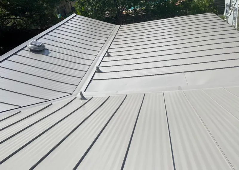 Solar attic fan installed on a metal roof for Roof Ventilation in Bonita Springs